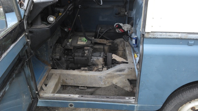The floor and seatbox out, very greasy transmission